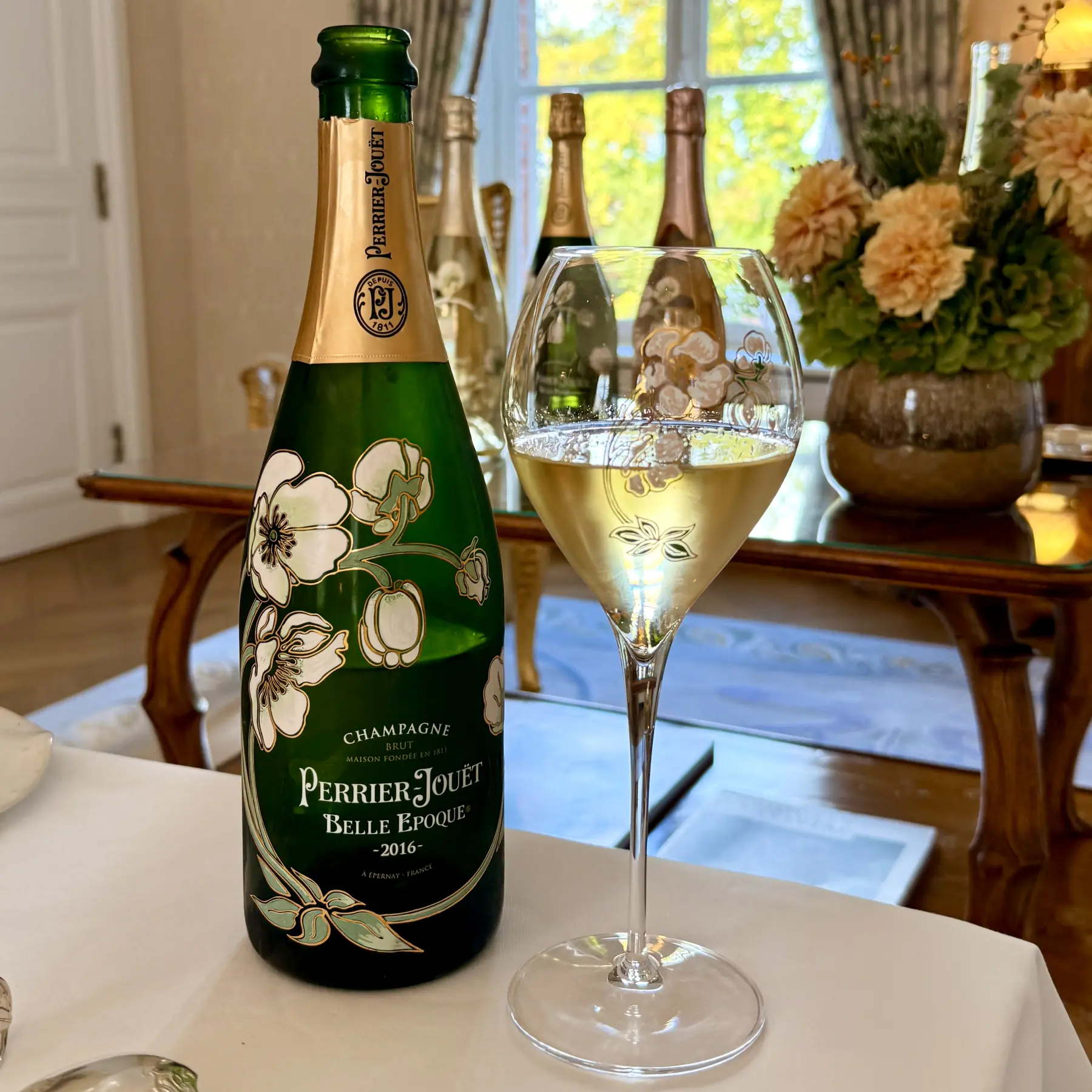 Perrier-Jouët Belle Epoque Brut 2016 with a glass