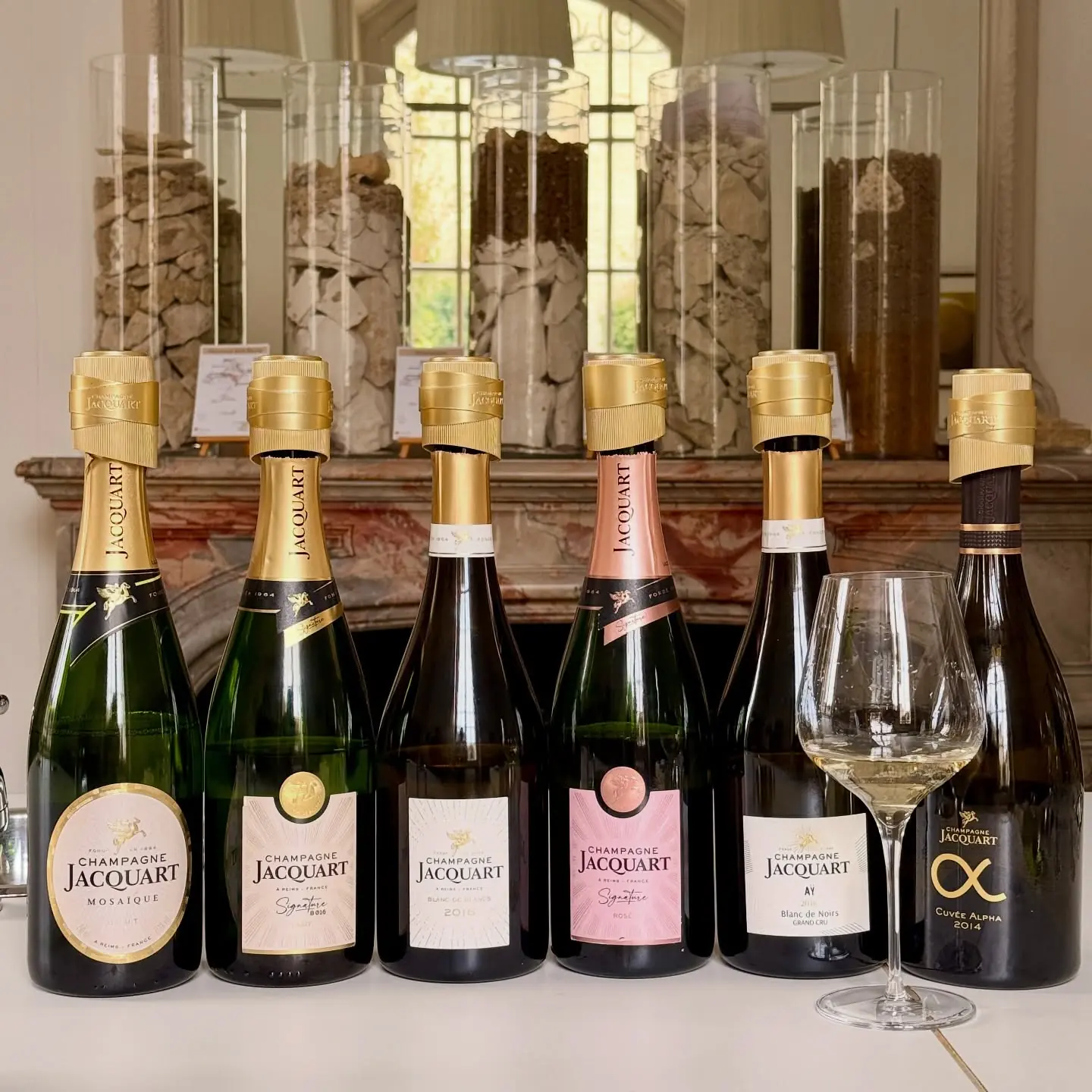Champagne Jacquart bottles on a tasting table