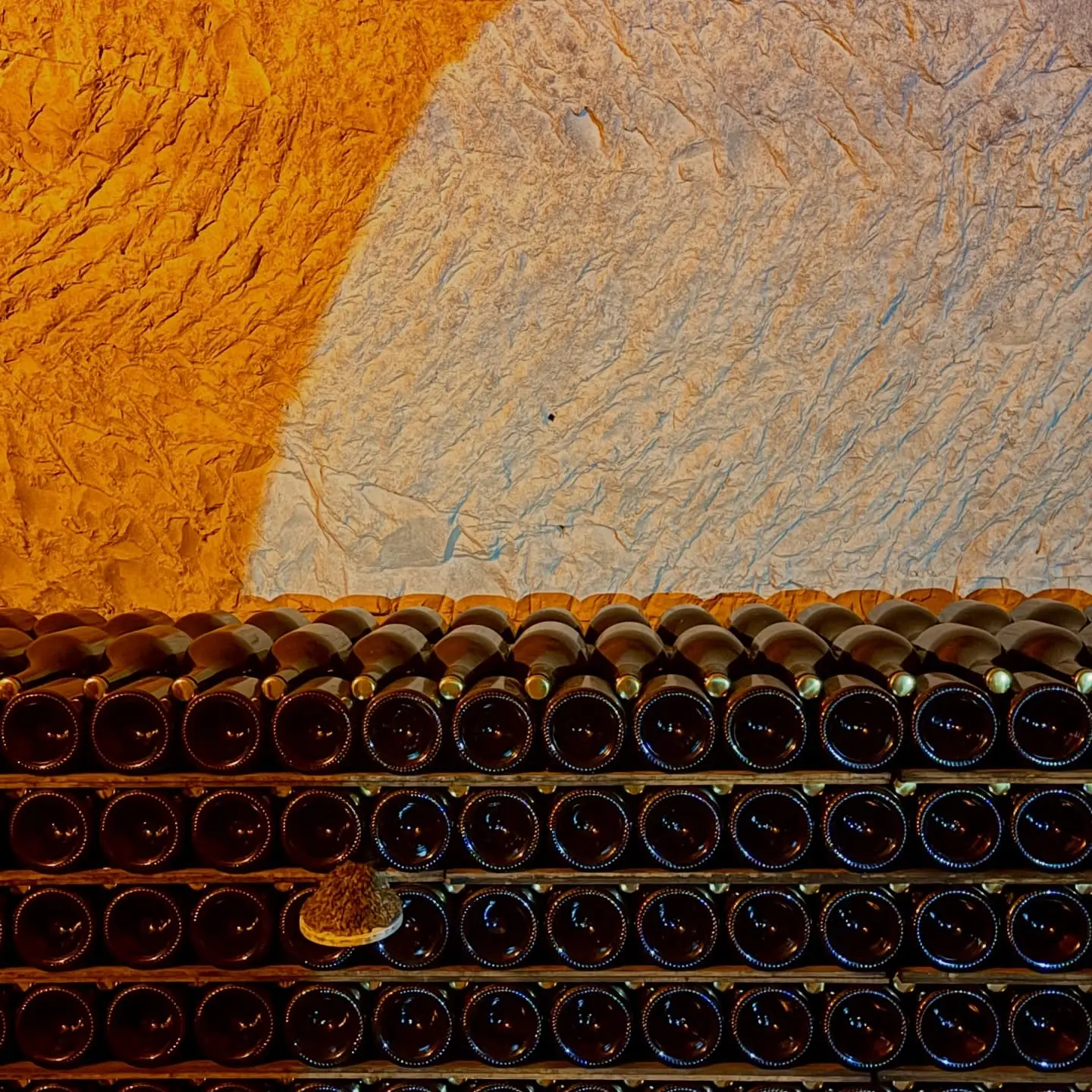 Bottles in the Taittinger chalk cellars