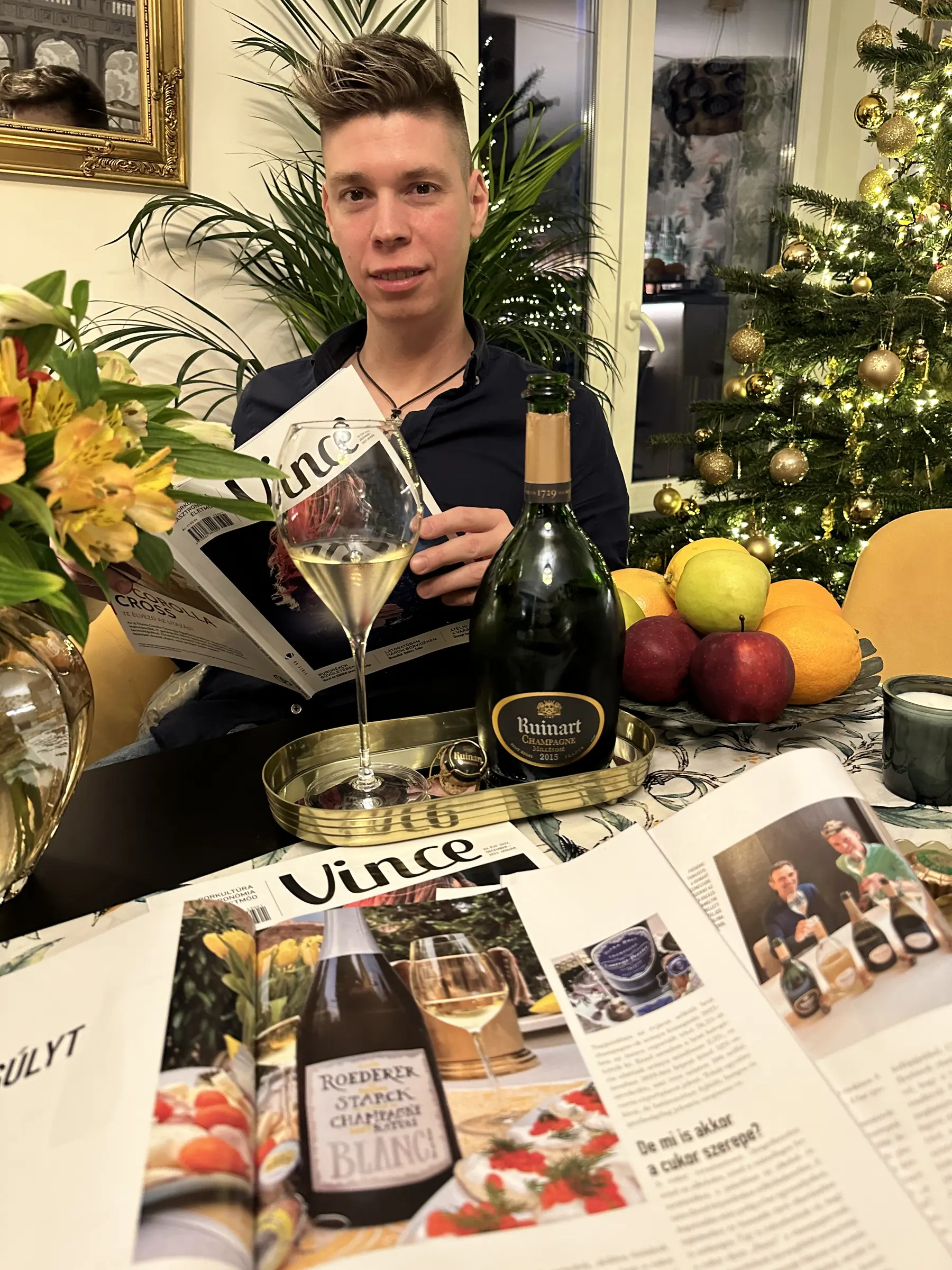 Mate Hajdu with Louis Roederer Brut Nature Champagne and the published article