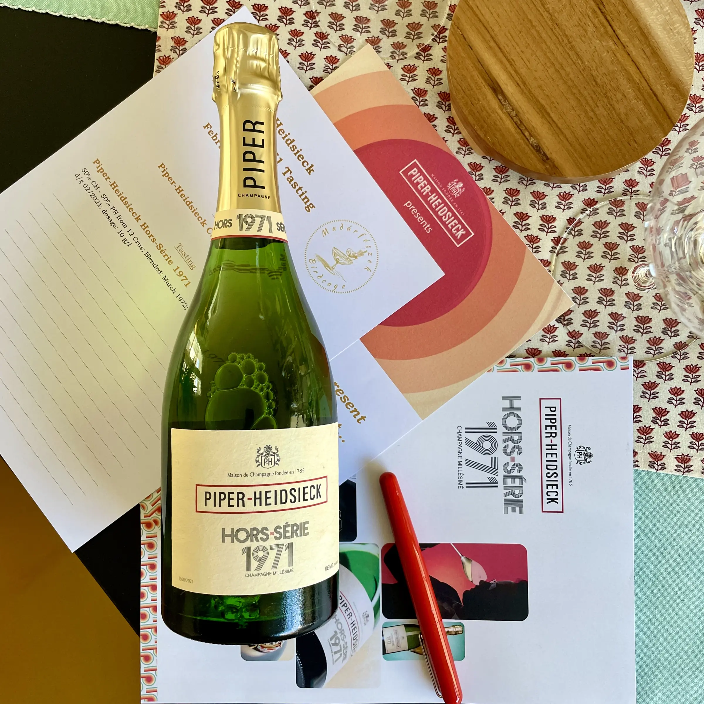 A bottle of Piper-Heidsieck Hors-Série 1971 beside the published article